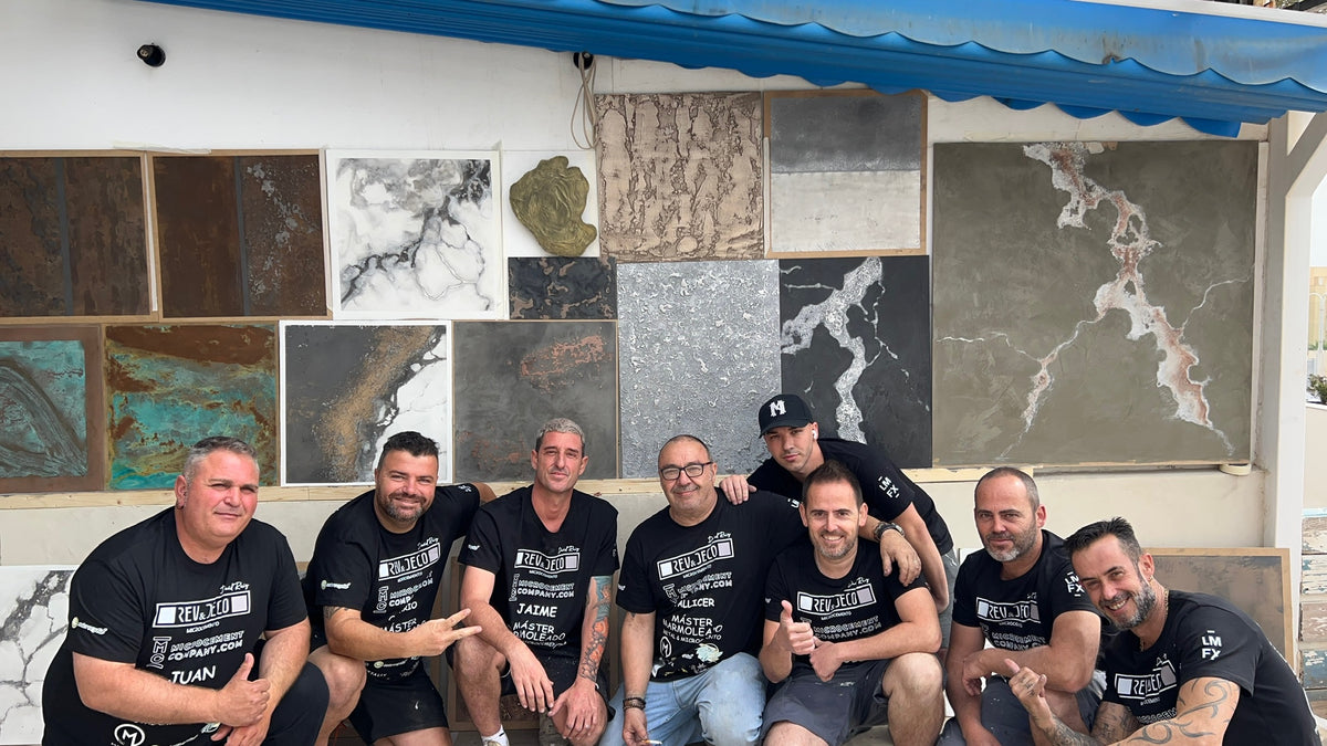 Course group in front of a wall of decorative finish sample panels