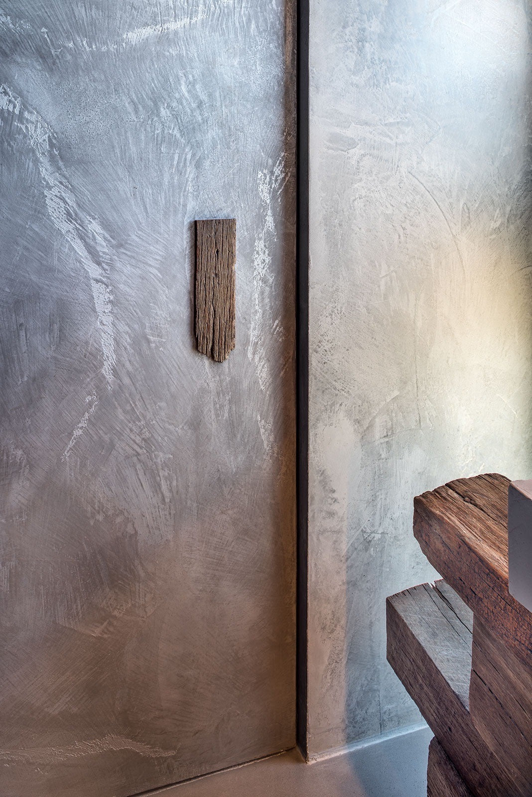 Silver metallic polished plaster wall beside reclaimed timber