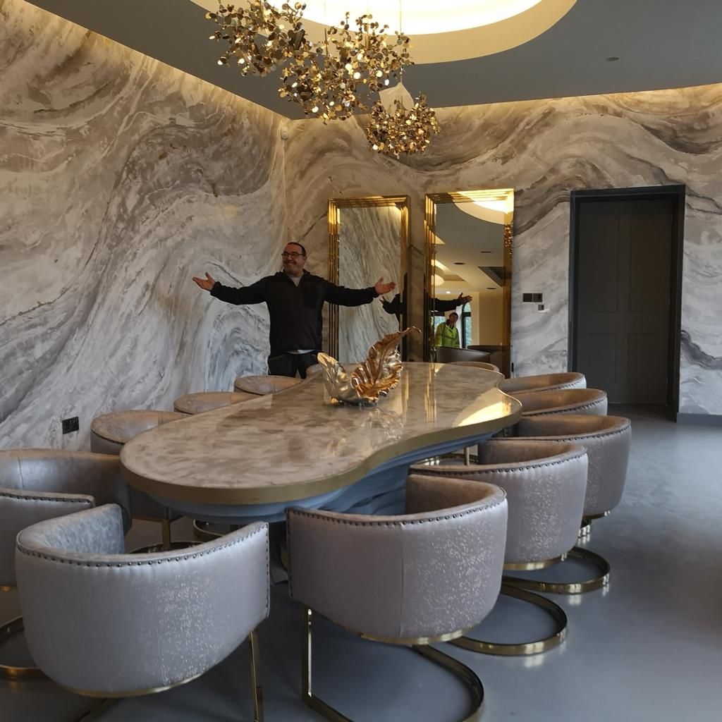 Dining room with swirling grey marble-effect polished plaster walls
