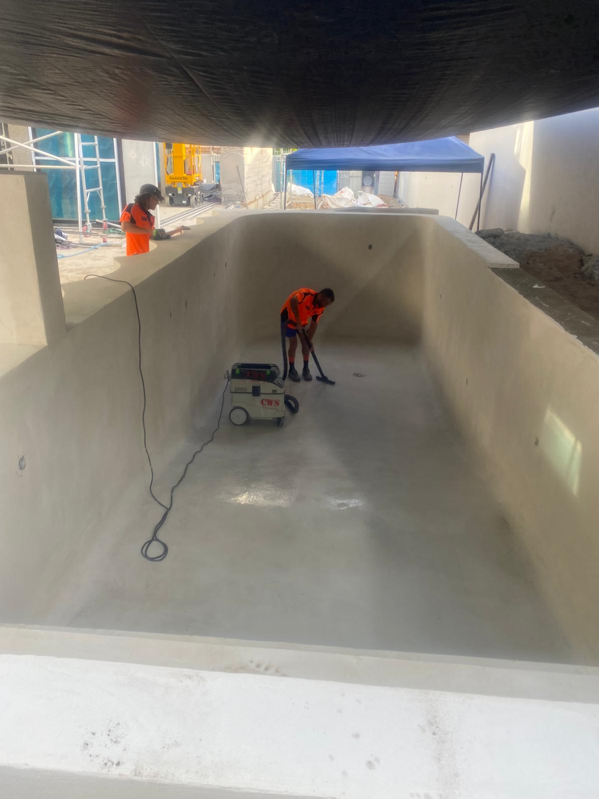 Indoor pool shell being finished in microcement