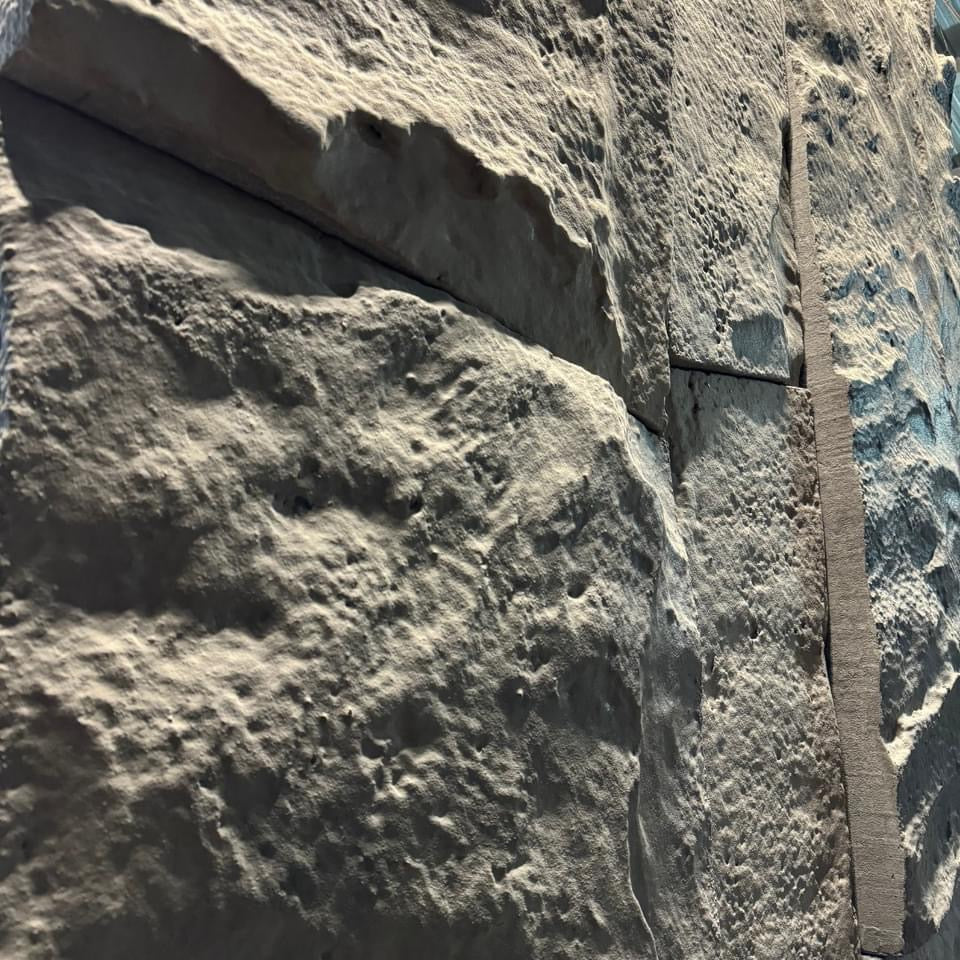 Close-up of sandstone-effect carved rock texture
